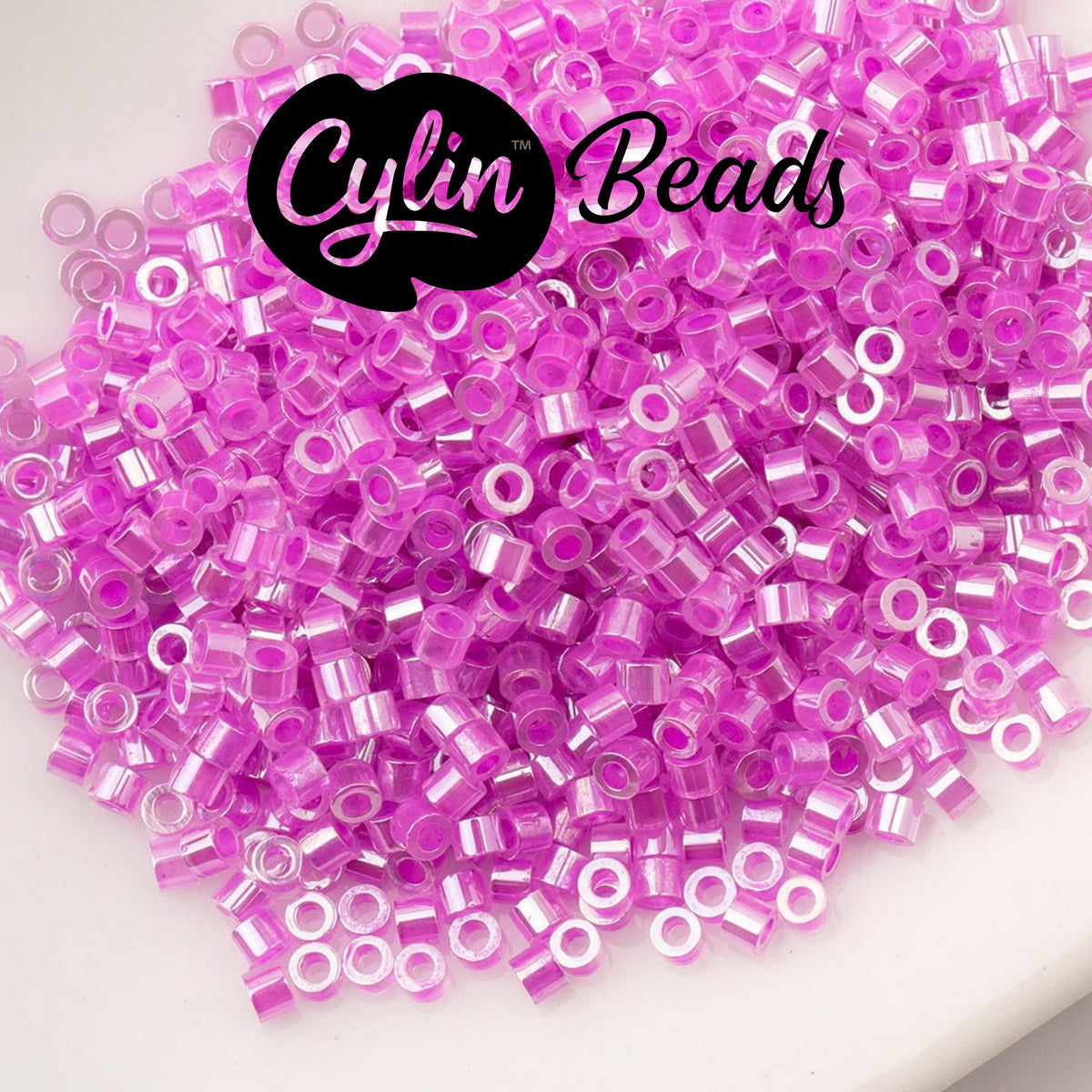 CY11-1033 11/0 Cylin Beads Crystal Fuchsia Lined Ceylon