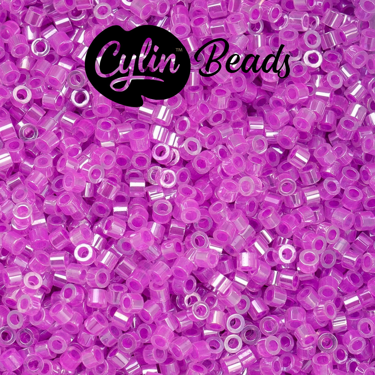 CY11-1033 11/0 Cylin Beads Crystal Fuchsia Lined Ceylon